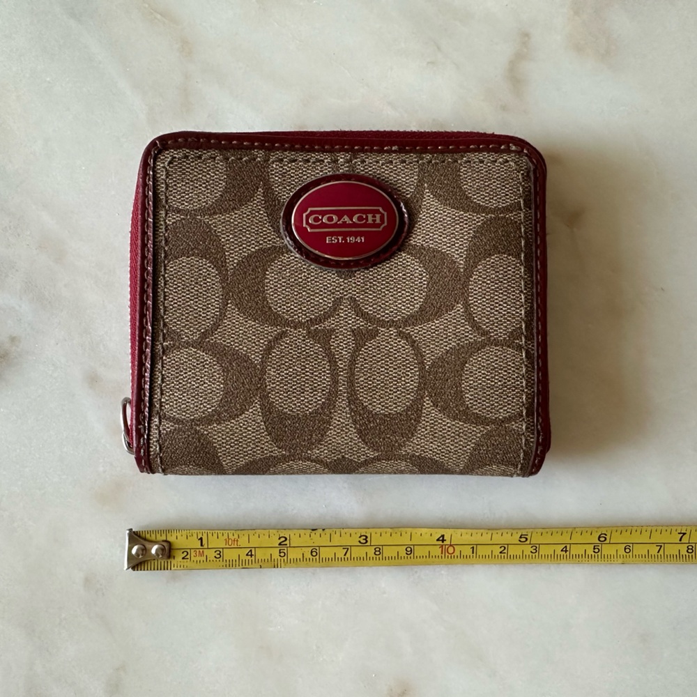 Coach wallet with six card slot, coin zipper pocket and bill holder.  Pre-owned